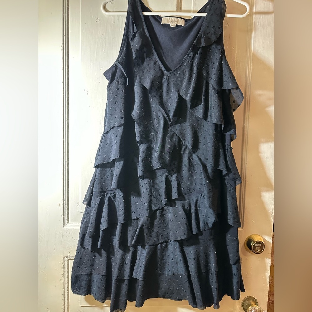 LOFT Navy Ruffle Dress

Jersey fabric on back to offset ruffle detail